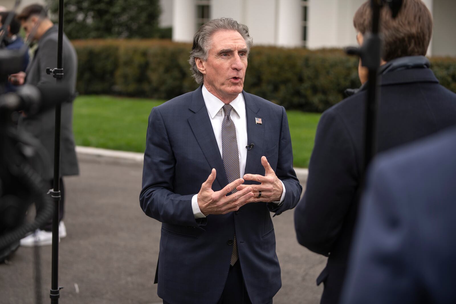 Interior Secretary Doug Burgum speaks with a reporter outside the West Wing of the White House, Thursday, April 10, 2025, in Washington. (AP Photo/Mark Schiefelbein)