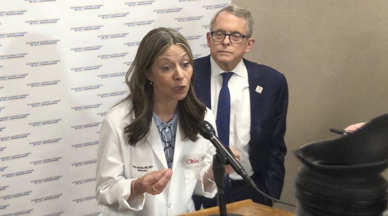 Dr. Amy Acton, Ohio Health Department Director, discusses the decision to issue an order sharply restricting spectators at the Arnold Sports Festival in Columbus over coronavirus fears, at a joint news conference with Gov. Mike DeWine, on Thursday, March 05, 2020, in Columbus, Ohio. Acton and DeWine said the size of the festival and the ability of spectators to move easily from event to event differentiates it from other sporting contests with large crowds, such as college basketball and professional sports games. (AP Photo/Andrew Welsh-Huggins)