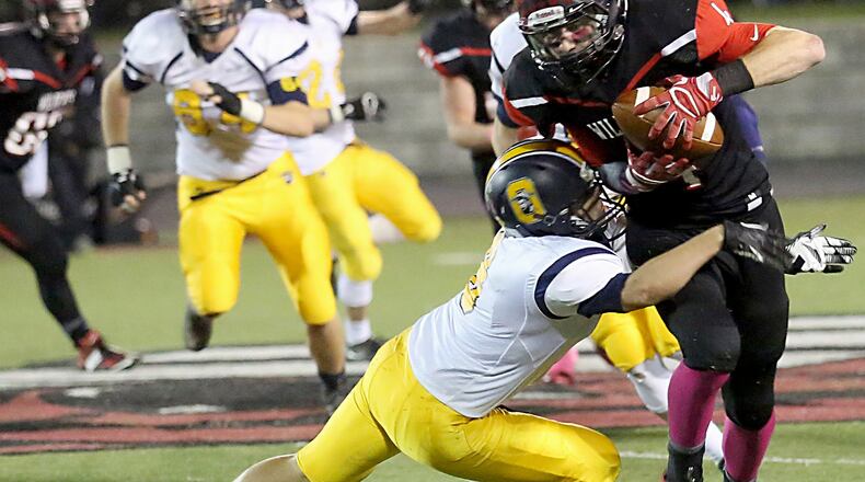 Franklin wide receiver Noah Kremer eludes Oakwood defensive back Connor Morris and runs for a touchdown during their game at Atrium Stadium in Franklin on Oct. 21. CONTRIBUTED PHOTO BY E.L. HUBBARD