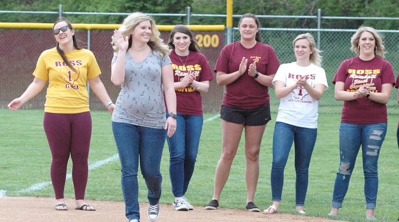 Brittany Berry Kohorst waves to the crowd at Ross High School on Wednesday during a ceremony honoring the Rams’ 2009 Division II state softball champions. RICK CASSANO/STAFF