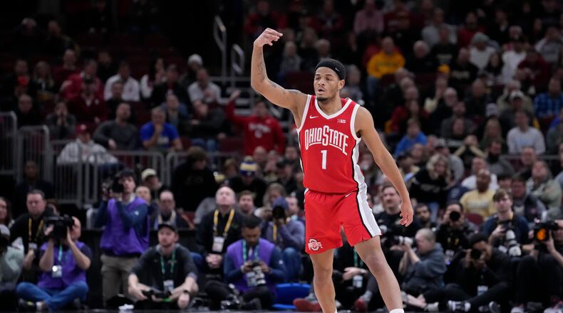 Ohio State's Roddy Gayle Jr. reacts after hitting a 3-point shot during the first half of an NCAA semifinal basketball game against the Purdue at the Big Ten men's tournament, Saturday, March 11, 2023, in Chicago. (AP Photo/Charles Rex Arbogast)