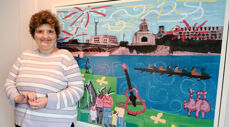 Inspiration Studios partnered with The Well House Hotel to create artwork to be displayed in 35 of 54 rooms of the soon-to-open hotel on South Monument Avenue. The artwork covers HVAC panels, and there are four different types of designs. Pictured is InsideOut Studio artist Beth Shaw with her art. MICHAEL D. PITMAN/STAFF