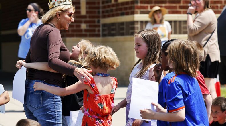 Ridgeway Elementary School principal Kathy Wagonfield was honored by teachers and hundreds of students Thursday, May 2, 2024 in Hamilton. She was surprised during a secret assembly to celebrate her. A tree was planted in her honor in front of the school. NICK GRAHAM/STAFF