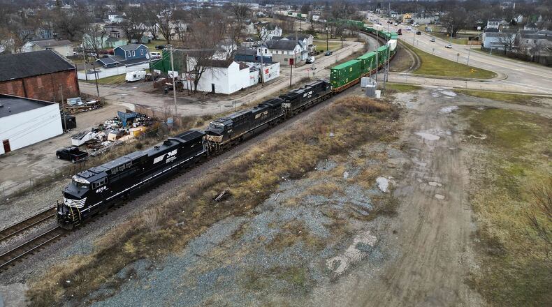 Pictured is a CSX train traveling toward Maple Avenue in Hamilton. The city could possibly receive two stops for different Amtrak passenger rail routes. A study is being conducted to determine the feasibility of stops along four routes in Ohio. A potential stop for a north-south line could be at Maple Avenue (pictured), and a potential stop for an east-west line could be on Sycamore Street. NICK GRAHAM/STAFF