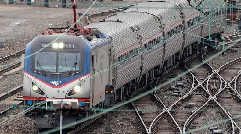 An Amtrak train departs 30th Street Station in Philadelphia, Wednesday, March 31, 2021. Looking beyond the $1.9 trillion COVID relief bill, President Joe Biden and lawmakers are laying the groundwork for another of his top legislative priorities — a long-sought boost to the nation's roads, bridges and other infrastructure that could meet GOP resistance to a hefty price tag. (AP Photo/Matt Rourke)
