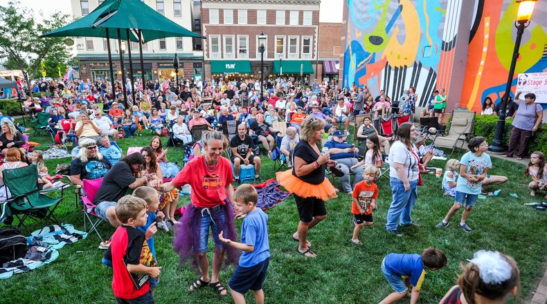 Members of the crowd dance along as The Menus perform during the Broad Street Bash last year in Middletown. The Menus will take the stage again June 13.
