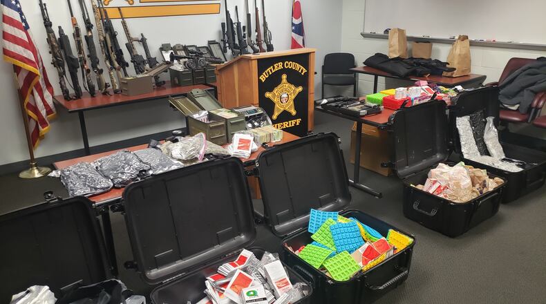 Two men were arrested and drugs, guns and molds for making THC edibles were seized after two Butler County houses were searched Thursday. BUTLER COUNTY SHERIFF'S OFFICE