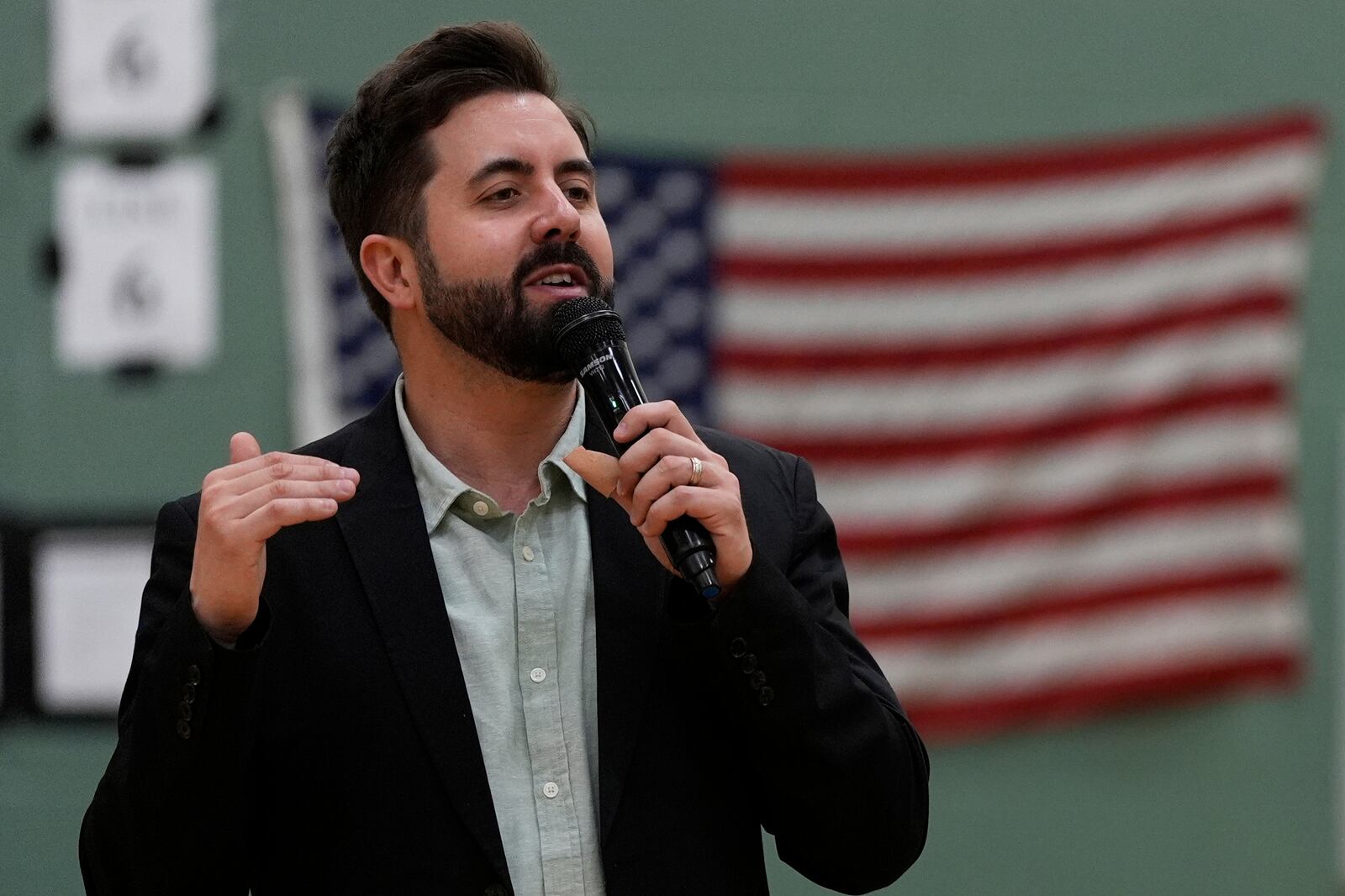 River Church Cincinnati pastor Cory Bowman, who is Vice President JD Vance's half brother and Cincinnati mayoral candidate, preaches during Easter worship service in the Hays Porter Elementary School gym Sunday, April 20, 2025, in Cincinnati. (AP Photo/Carolyn Kaster)