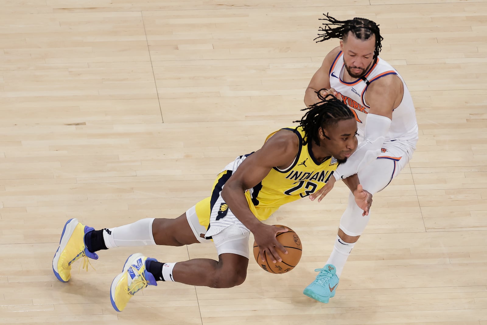 Indiana Pacers forward Aaron Nesmith (23) drives against New York Knicks guard Jalen Brunson (11) during the fourth quarter of Game 2 of the NBA basketball Eastern Conference final, Friday, May 23, 2025, in New York. (AP Photo/Adam Hunger)