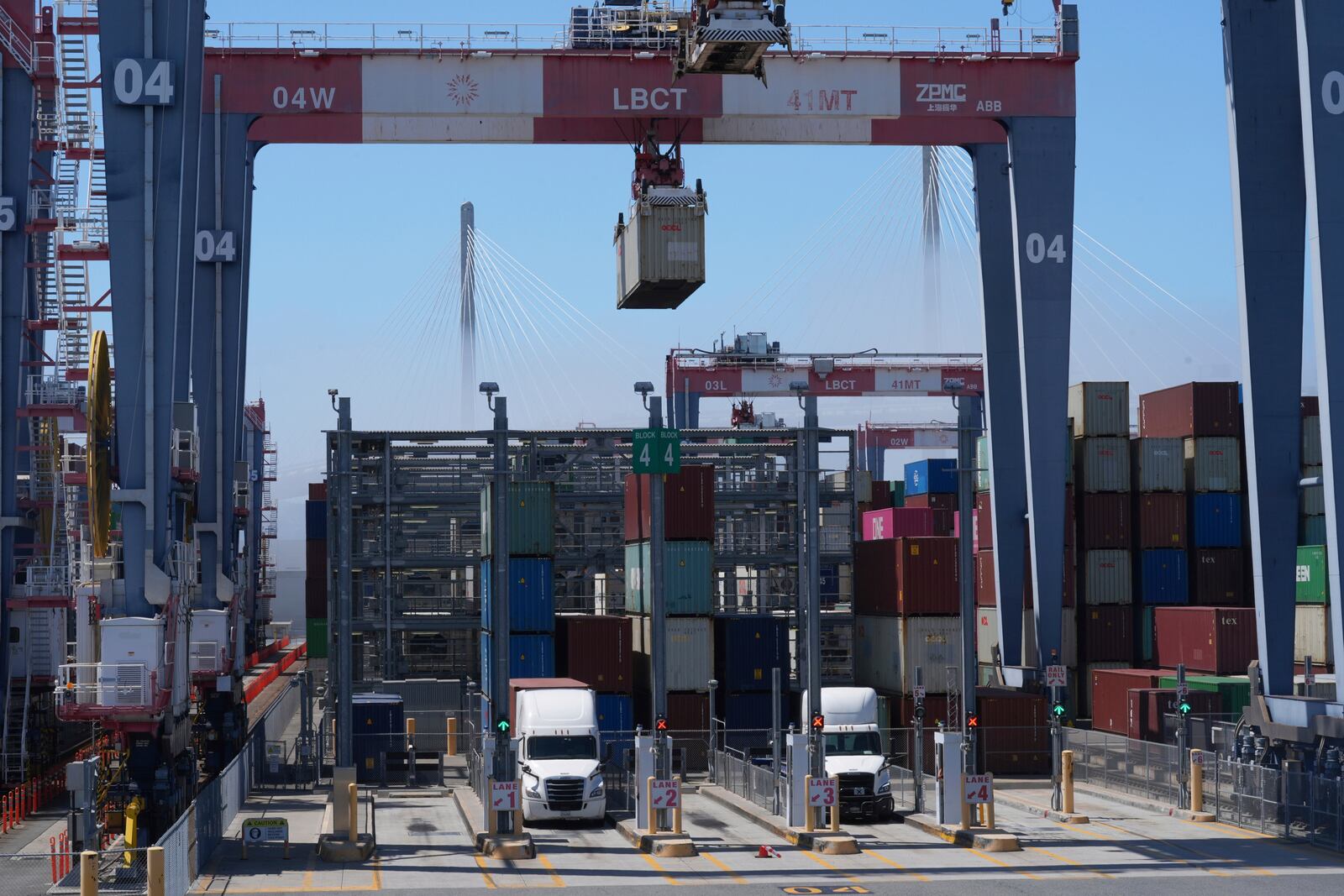 FILE - Shipping containers are loaded onto waiting trucks at the Long Beach Container Terminal in Long Beach, Calif., April 8, 2025. (AP Photo/Damian Dovarganes, File)