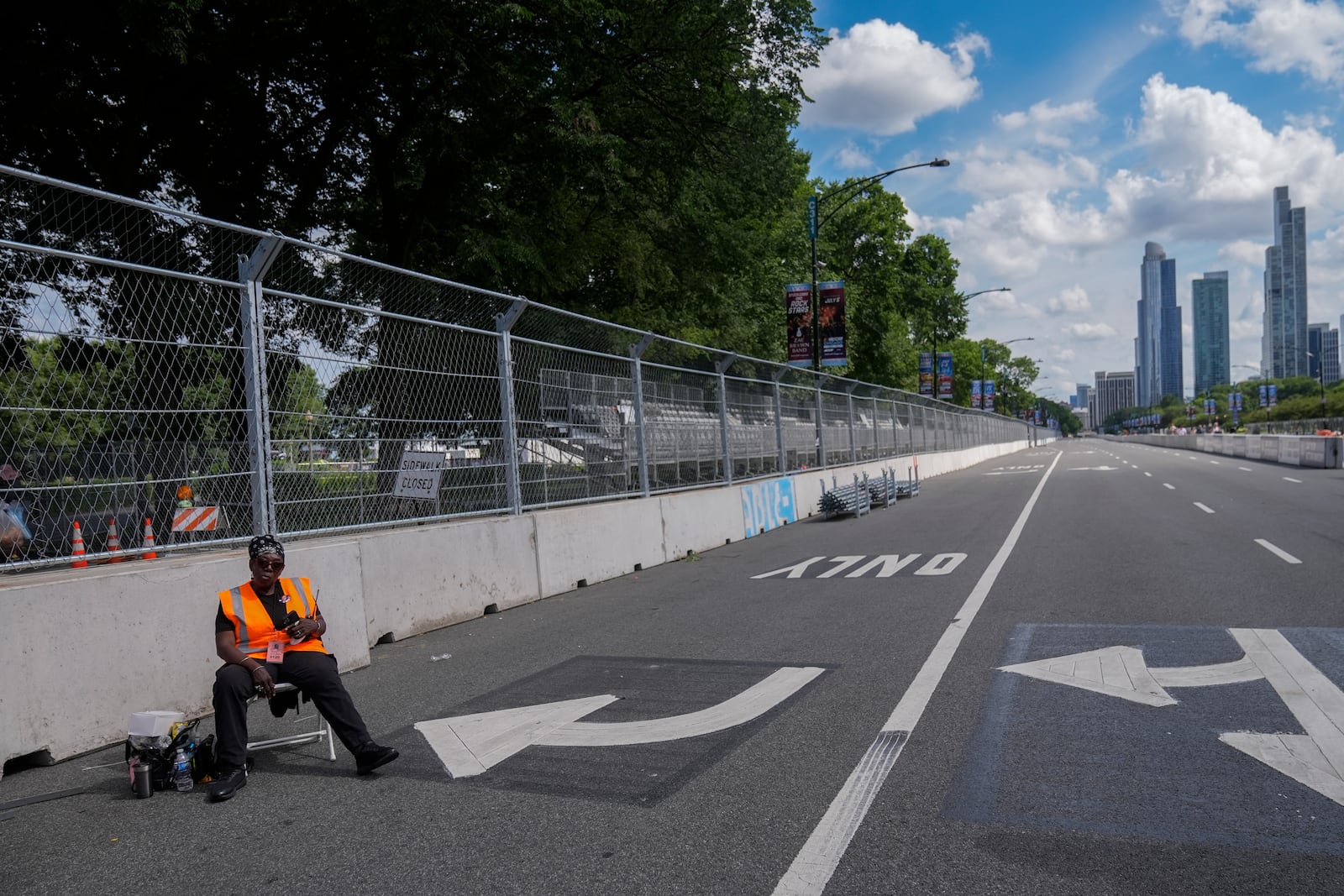 Construction of the street course continues ahead of the NASCAR auto racs, Friday, June 27, 2025, in downtown Chicago. (AP Photo/Erin Hooley)
