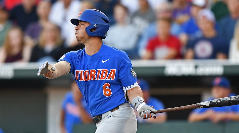 Florida third baseman Jonathan India hits a two run double against the LSU Tigers in the third inning during game one of the College World Series Championship Series on June 26, 2017 at TD Ameritrade Park in Omaha, Nebraska. (Photo by Peter Aiken/Getty Images)