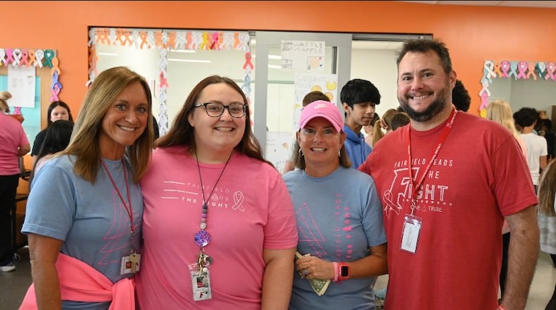 Fairfield School officials say recent cancer fundraiser at its freshman school helped raise record $17,000 for teacher battling the disease. Left to right: Fairfield Freshman School staff members Colleen Larbes, art teacher; Brittany Coomes, educational assistant; Becky Doak, health teacher; and Logan Estes, intervention specialist are pictured enjoying the annual cross-curricular fundraising event that connects science, health, and cooking classes. Doak is one of the founders of Fairfield Leads the Fight, the non-profit that puts on the fundraiser. Students create a carnival atmosphere to showcase their research about cancer, plan games, sell baked goods they make, and bring in community groups to sponsor refreshments, prizes, and raffle baskets.