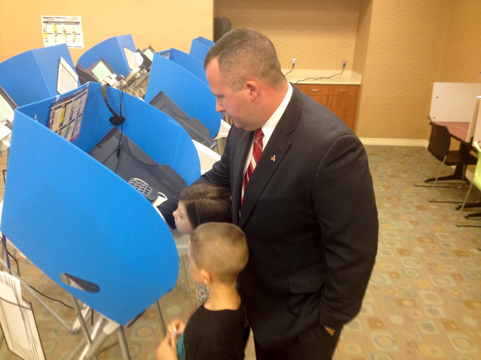 State Rep. Wes Retherford, R-Hamilton, casts an early vote with his children in 2014. Retherford says he isn't certain what he'll do after he leaves office in December, but until then he said he'll push his Victims Privacy and Protection Act.  