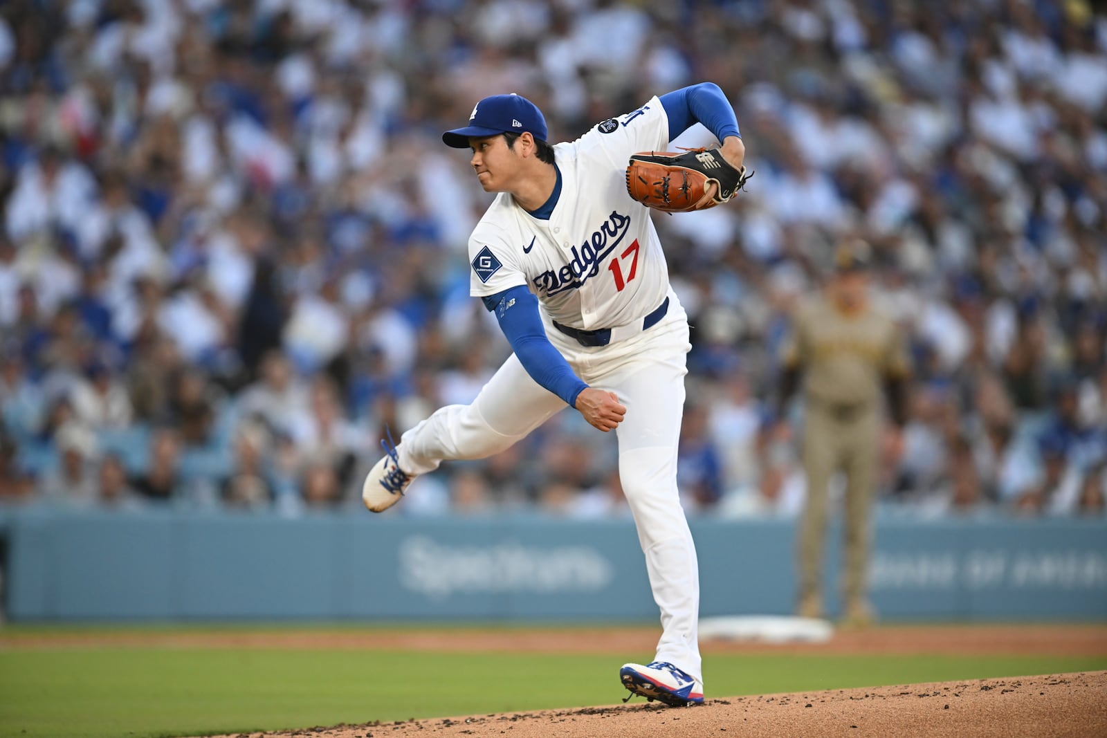 Los Angeles Dodgers starting pitcher Shohei Ohtani throws to a San Diego Padres batter during the first inning of a baseball game Monday, June 16, 2025, in Los Angeles. (AP Photo/Kyusung Gong)
