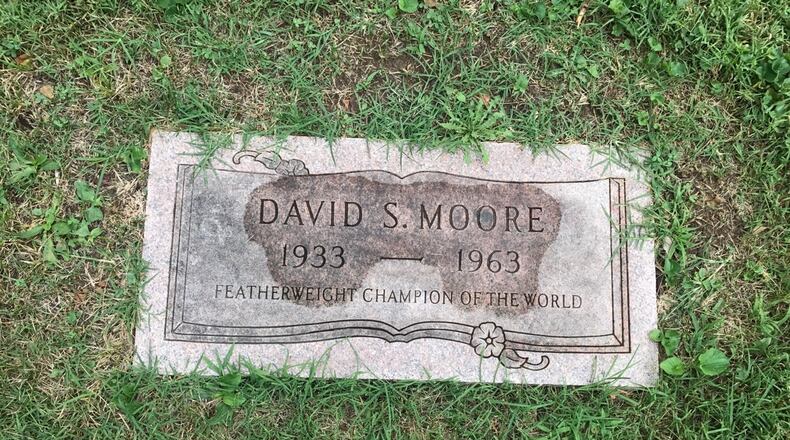 The gravestone of Davey Moore, the world featherweight champ from Springfield, who died from injuries sustained in his nationally televised world title fight with Ultiminio “Sugar” Ramos at Dodger Stadium in March of 1963. Over 10,000 people came to his funeral viewing in Los Angeles and another 10,000 passed his casket as he lay in rest in Springfield. Thousands followed his casket from the church to Ferncliff Cemetery for his burial. Tom Archdeacon/CONTRIBUTED