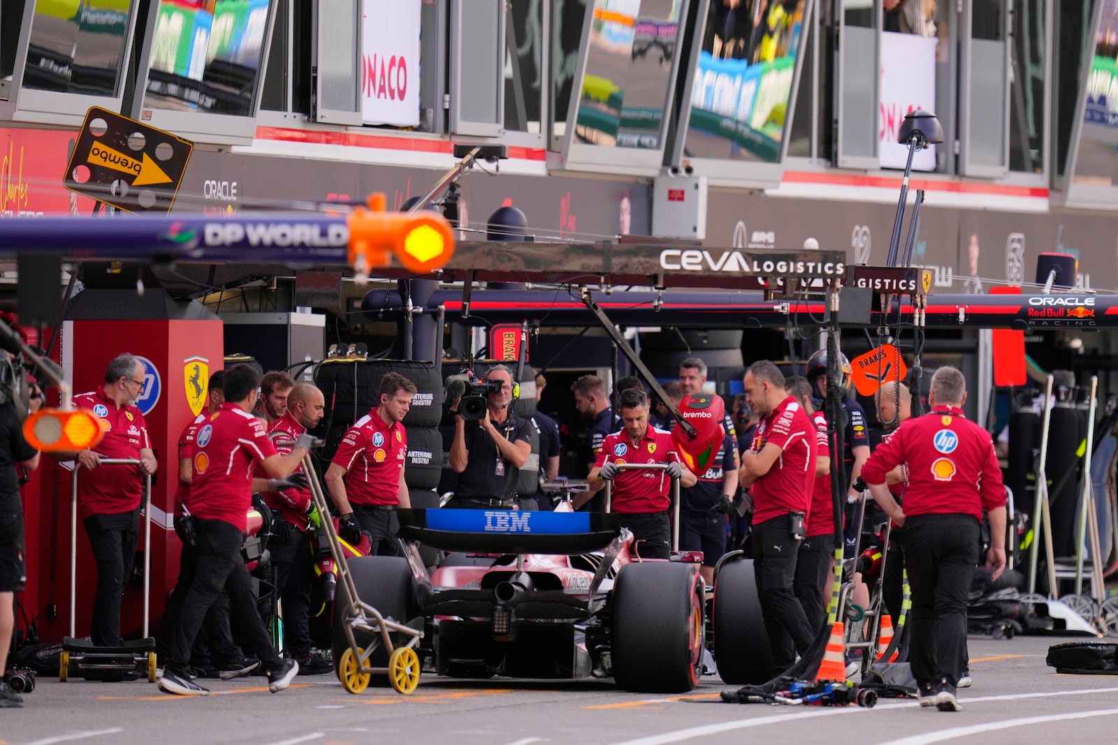 Ferrari driver Charles Leclerc of Monaco gets a pit service during the qualifying session ahead of the Formula One Monaco Grand Prix race at the Monaco racetrack in Monaco, Saturday, May 24, 2025. (AP Photo/Manu Fernandez)