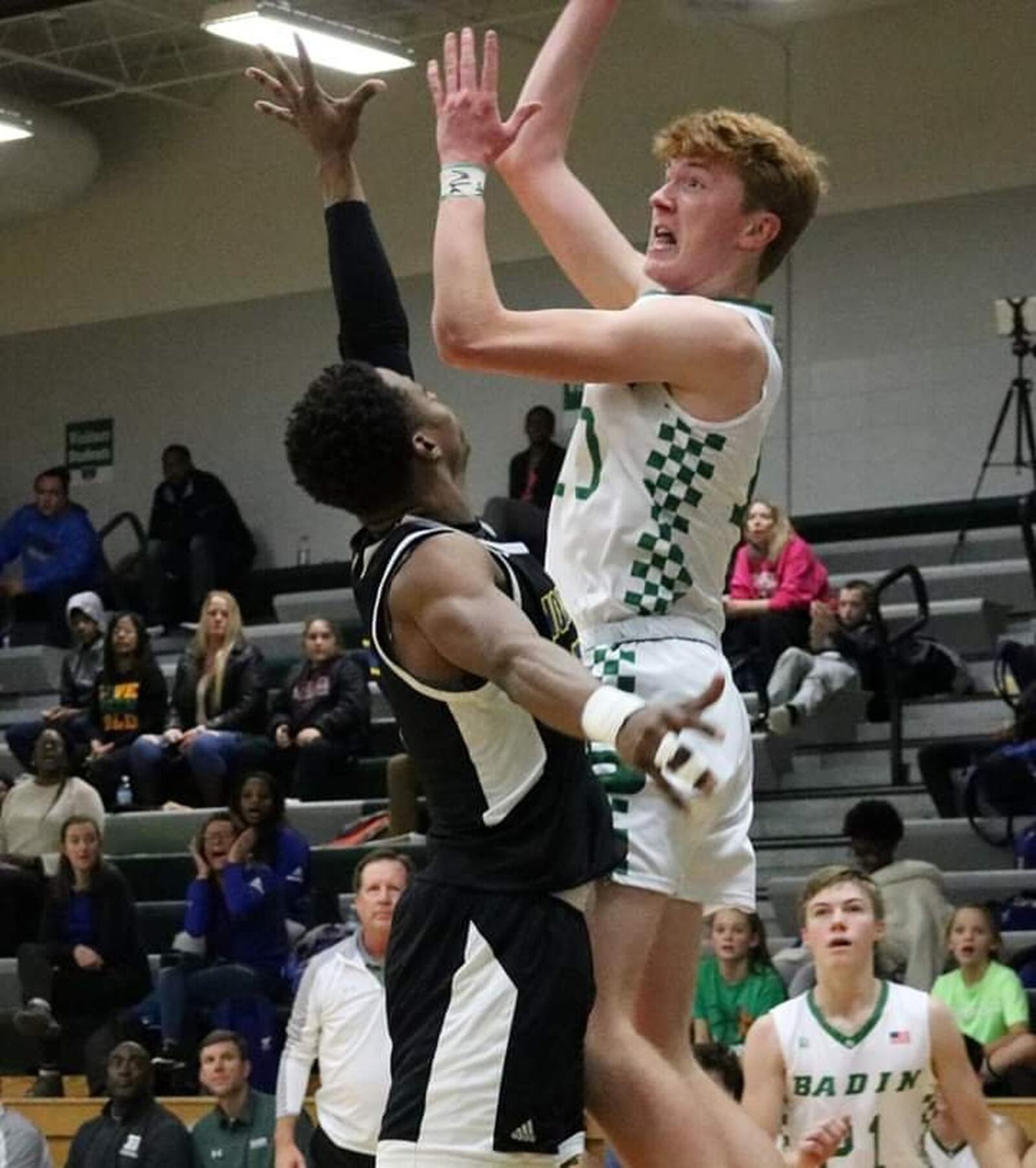 Badin’s Zach Switzer (10) gets a shot off over the defensive efforts of Northwest’s Dae’Mon Cherry during Tuesday night’s game at Mulcahey Gym in Hamilton. Badin won 70-52. CONTRIBUTED PHOTO BY TERRI ADAMS