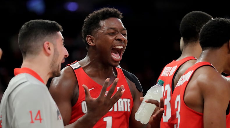 NEW YORK, NY - JANUARY 20: Jae'Sean Tate #1 of the Ohio State Buckeyes cheers from the sideline against the Minnesota Golden Gophers in the second half during their game at Madison Square Garden on January 20, 2018 in New York City. (Photo by Abbie Parr/Getty Images)