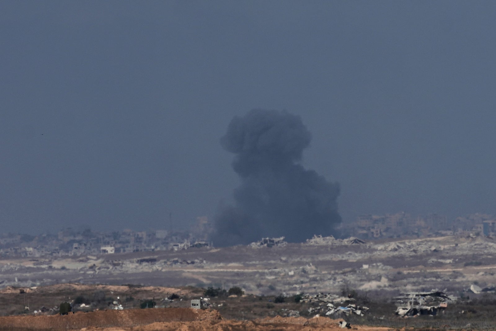 Smoke from an Israeli bombardment rises over the Gaza Strip, seen from southern Israel, Sunday, July 6, 2025. (AP Photo/Ohad Zwigenberg)