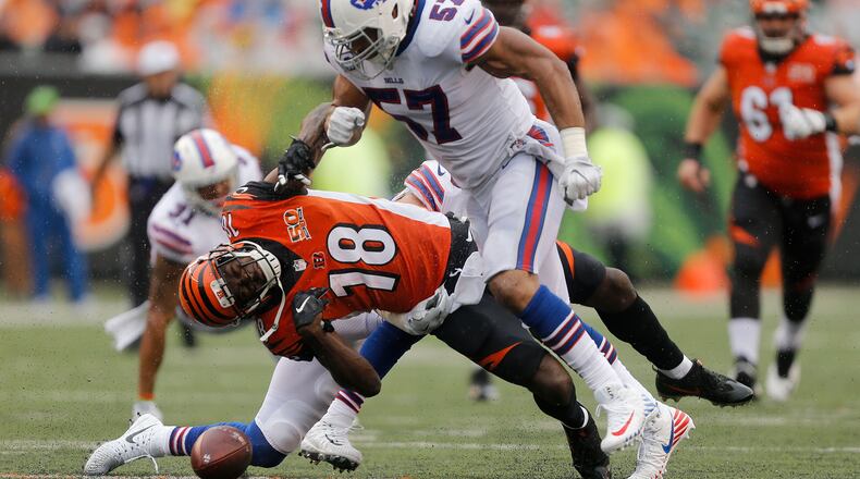 CINCINNATI, OH - OCTOBER 8: Lorenzo Alexander #57 of the Buffalo Bills knocks down A.J. Green #18 of the Cincinnati Bengals during the third quarter at Paul Brown Stadium on October 8, 2017 in Cincinnati, Ohio. (Photo by Michael Reaves/Getty Images)