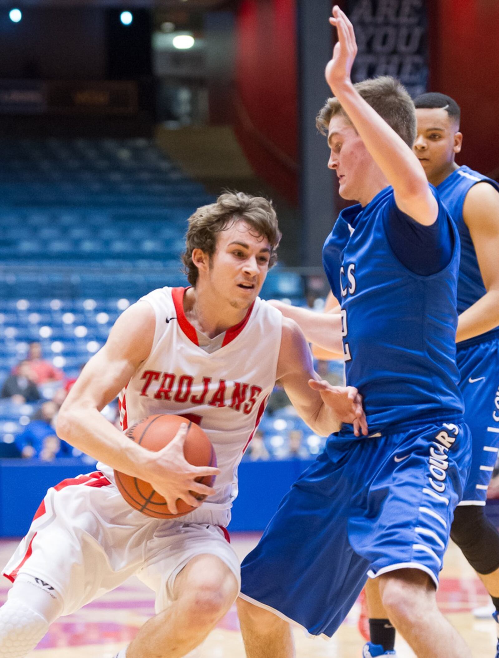 Cincinnati Christian’s Josh Oates blocks the path of South Charleston Southeastern’s Trevor King during Friday night’s Division IV district final at the University of Dayton Arena. CONTRIBUTED PHOTO BY BRYANT BILLING