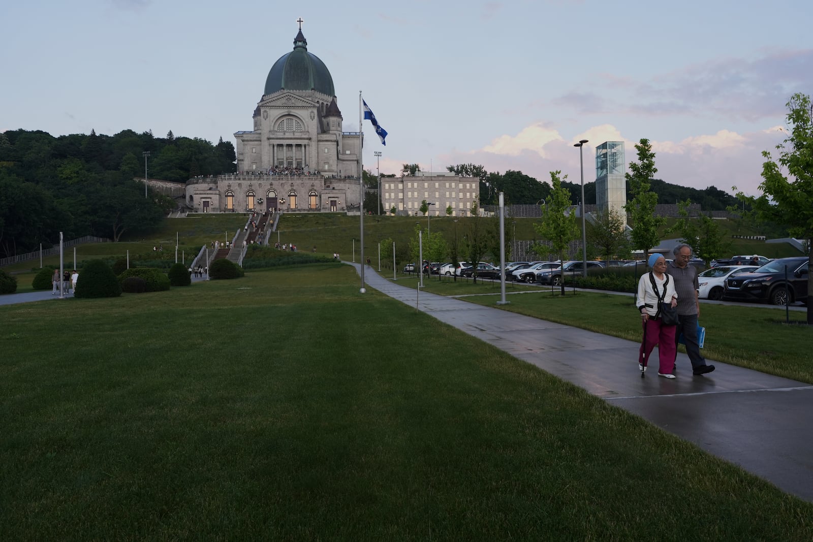 Visitors leave the national shrine of Saint Joseph's Oratory of Mount Royal in Montreal, Saturday, June 28, 2025. (AP Photo/Luis Andres Henao)