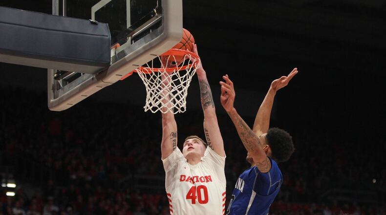 Dayton’s Chase Johnson dunks against Indiana State on Saturday, Nov. 9, 2019, at UD Arena. David Jablonski/Staff