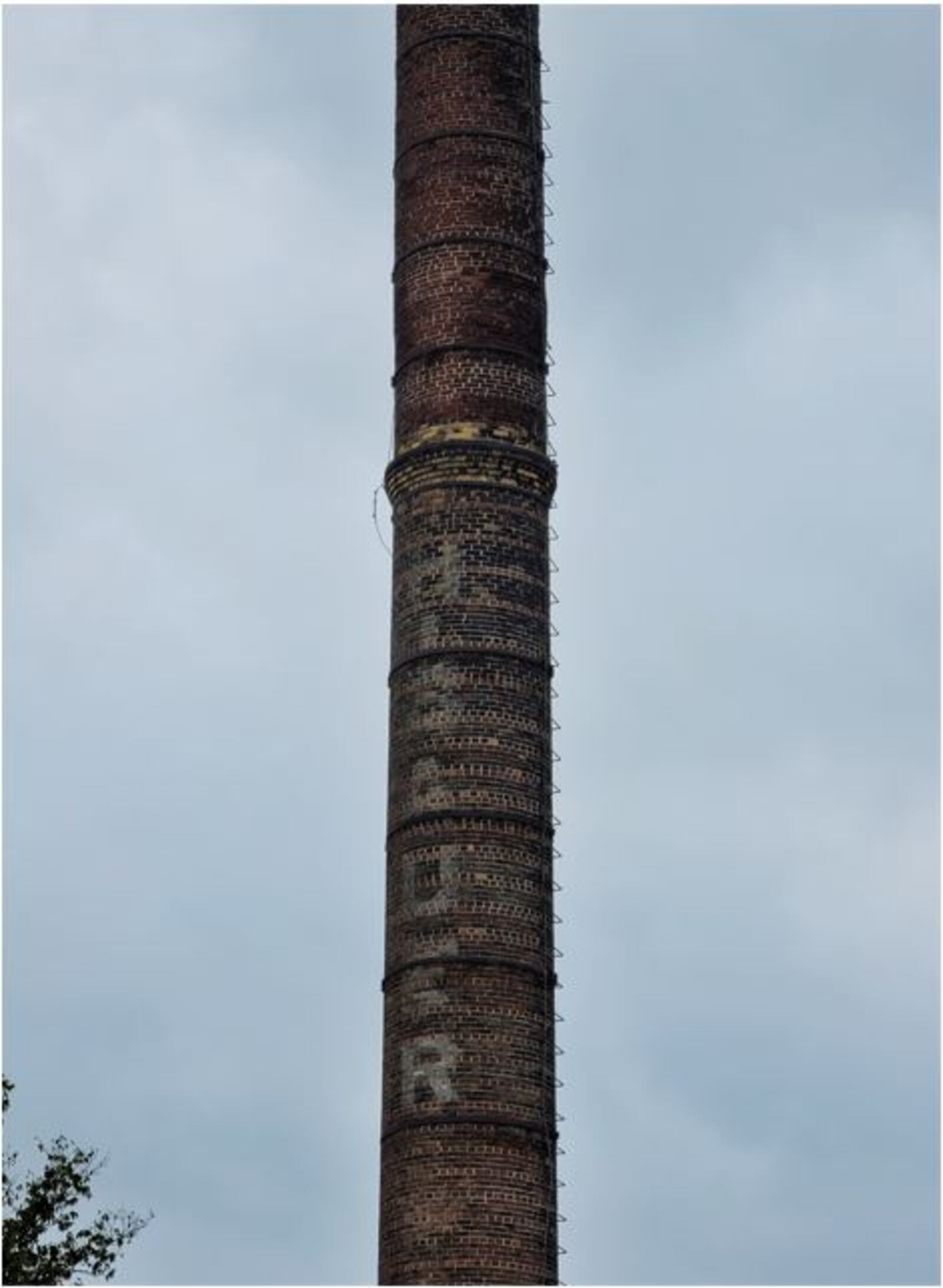 While most of the abandoned and dangerous French Bauer Dairy building has been demolished, city staff are pleased the historic smokestack, a reminder of Hamilton's industrial past, remains. NICK GRAHAM/STAFF