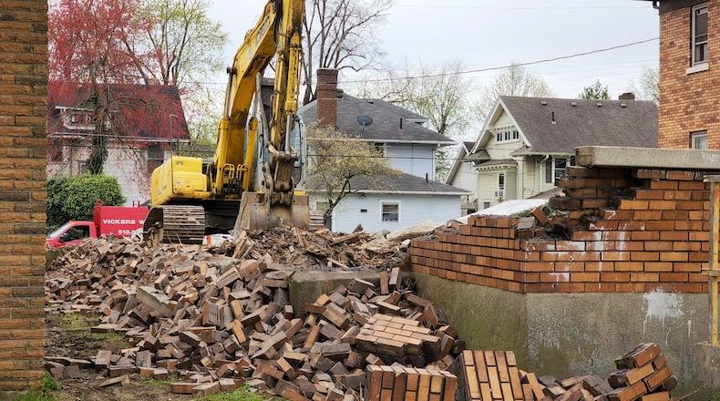 Vickers Demolition knocked down a house on Central Avenue in Middletown that was in danger of collapsing and damaging the house next door, according to city officials. NICK GRAHAM/STAFF