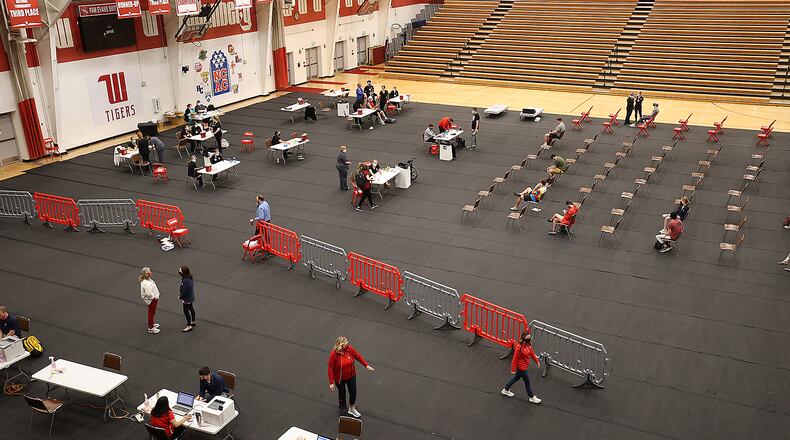 A COVID vaccination clinic is set up in the Pam Evans Smith Arena on the Wittenberg University campus. BILL LACKEY/STAFF