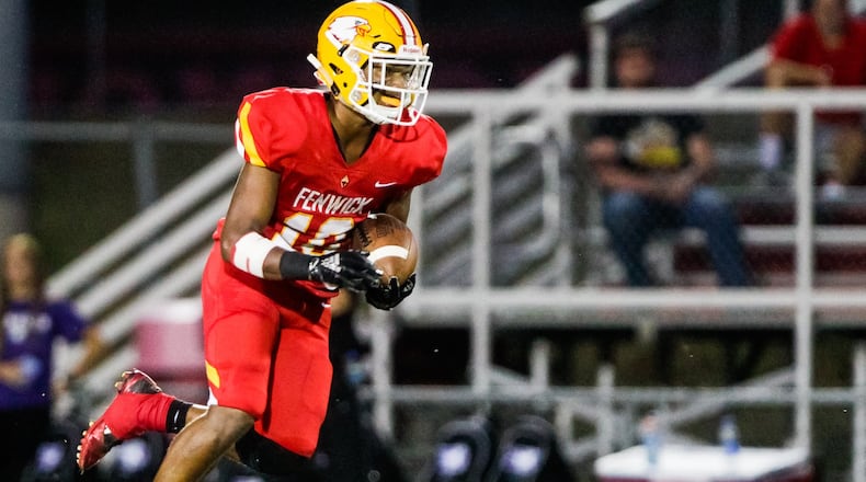Fenwick’s Jordan Rucker runs the ball during their football game against St. Francis DeSales Friday, Sept. 27 at Bishop Fenwick High School. St. Francis DeSales won 42-22. NICK GRAHAM/STAFF