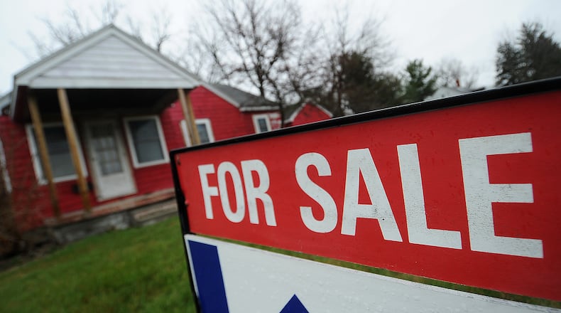 Sales of single-family homes in the Dayton area saw an 10.6% drop in sales in March compared to a year ago. March was the seventh consecutive month of decreases in year-over year sales. Pictured is a home for sale on Woodman Drive in Riverside. MARSHALL GORBY/STAFF