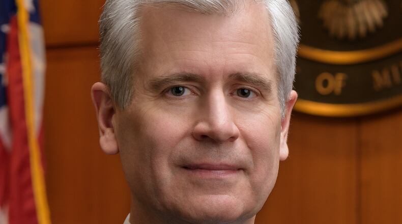 This undated photo provided by the U.S. District Court of Minnesota Thursday, Jan. 29, 2026, shows Chief U.S. District Judge Patrick Schiltz posing for a portrait in his Minneapolis courtroom. (U.S. District Court of Minnesota via AP)