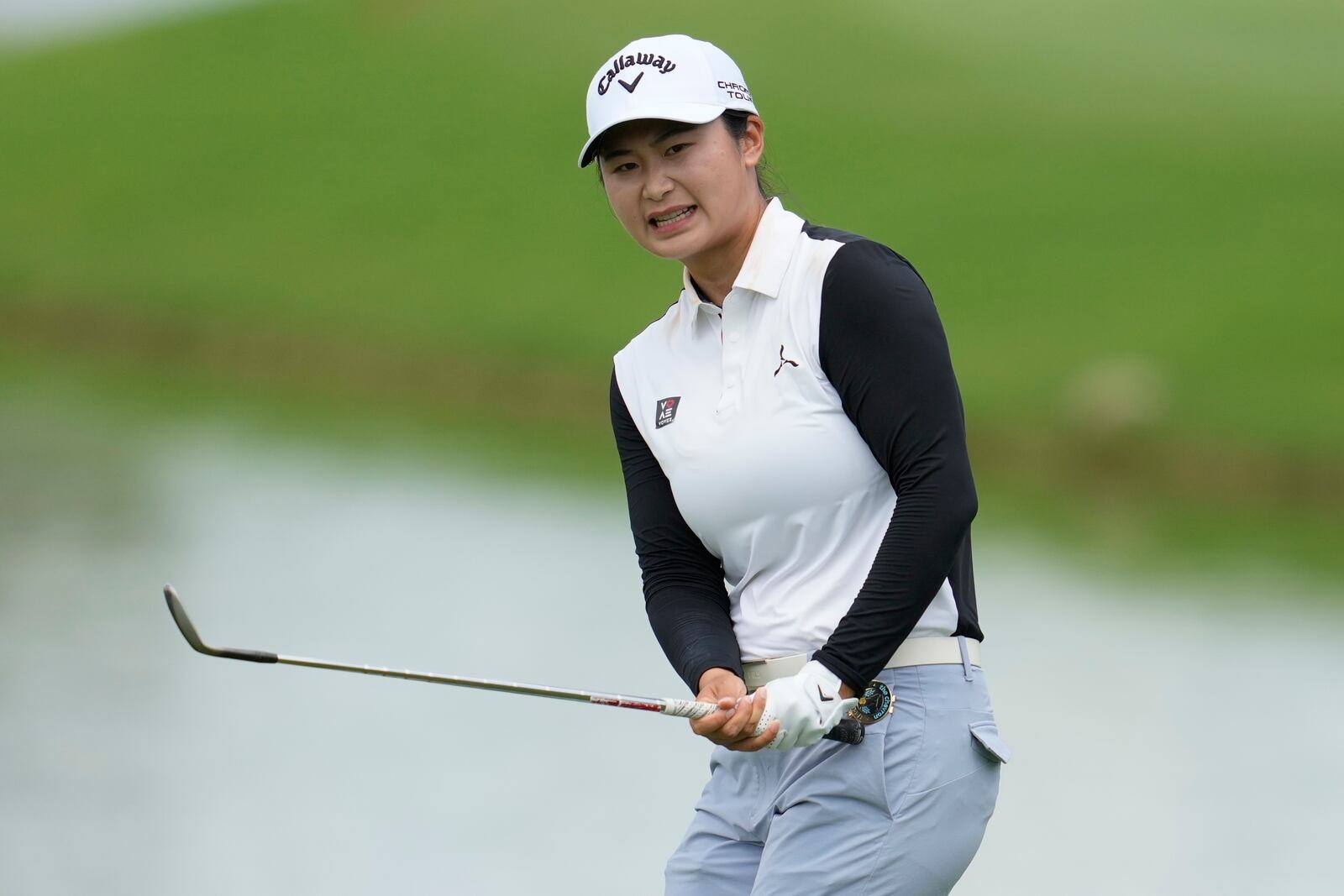 Yan Liu, of China, reacts to her shot on the nineth green during the third round of the Chevron Championship LPGA golf tournament Saturday, April 26, 2025, in The Woodlands, Texas. (AP Photo/Ashley Landis)