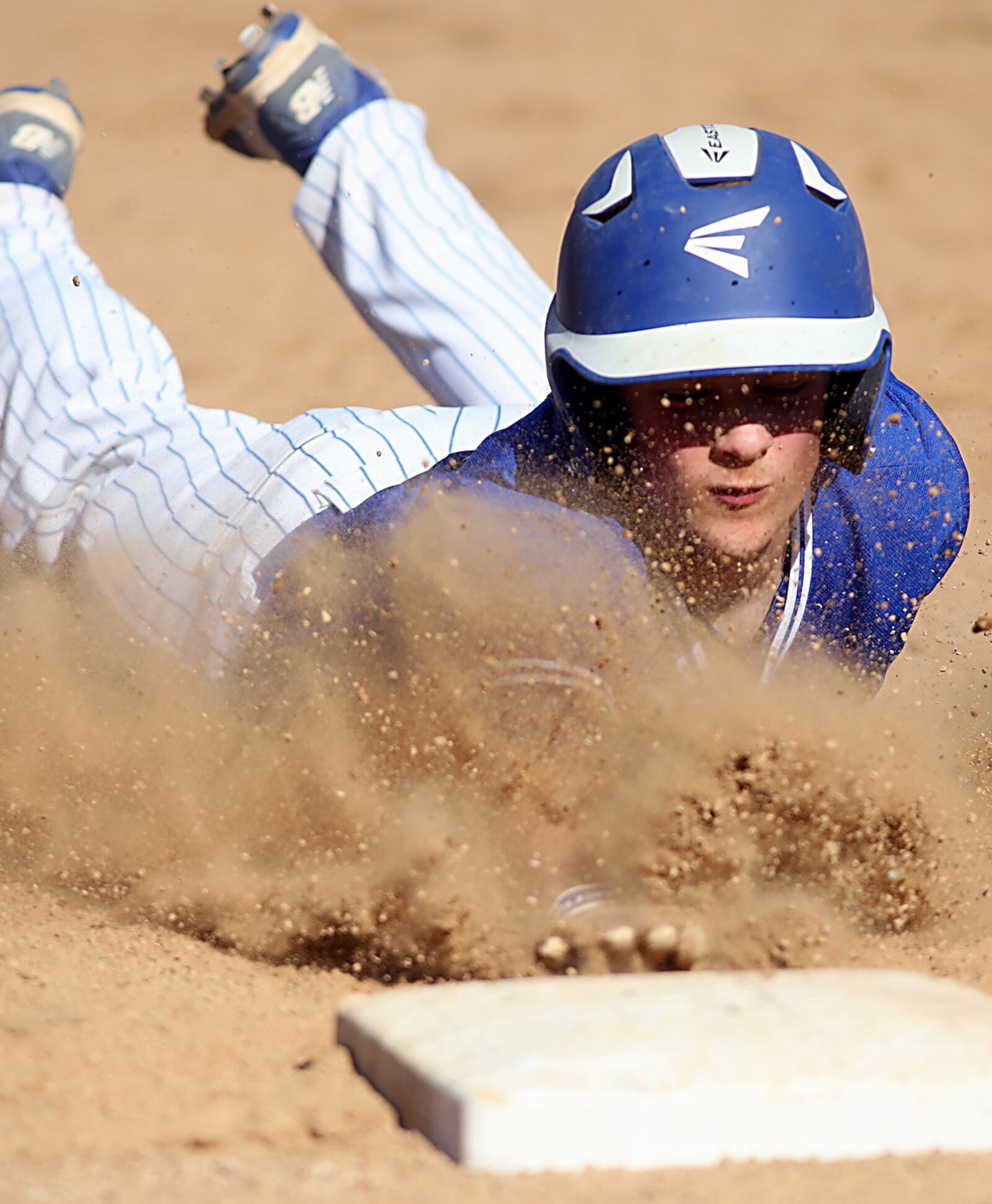 Hamilton’s Alex Mills dives safely back to first base during Sunday’s game against Fairfield at Joe Nuxhall Field in Fairfield. CONTRIBUTED PHOTO BY E.L. HUBBARD