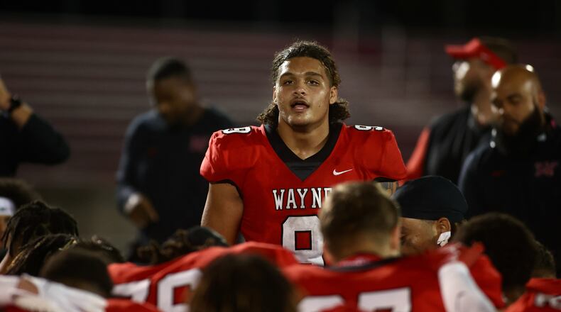 Wayne's Javon Hammonds talks to the team after a victory against Fairfield on Friday, Aug.18, 2023, at Heidkamp Stadium in Huber Heights. David Jablonski/Staff