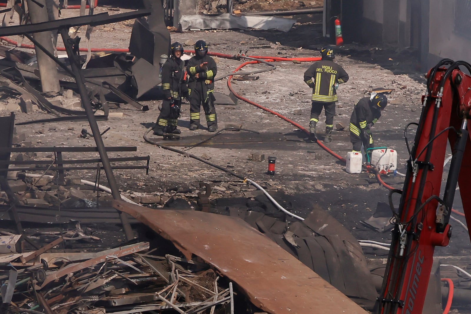 Firefighters at the scene of an explosion at a gas station in Rome, Italy, Friday, July 4, 2025. (Cecilia Fabiano/LaPresse via AP)