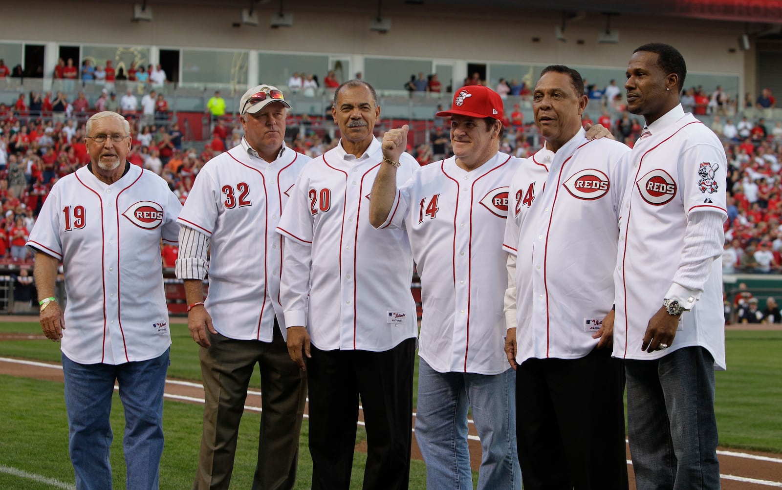 FILE - Former Cincinnati Reds great Pete Rose (14) meets with former teammates, left to right, Tommy Helms, Tom Browning, Cesar Geronimo, Tony Perez, and Eric Davis, during ceremonies celebrating the 25th anniversary of Rose breaking Ty Cobb's hit record prior to a baseball game between the Reds and Pittsburgh Pirates, Saturday, Sept. 11, 2010, in Cincinnati. (AP Photo/Al Behrman, File)