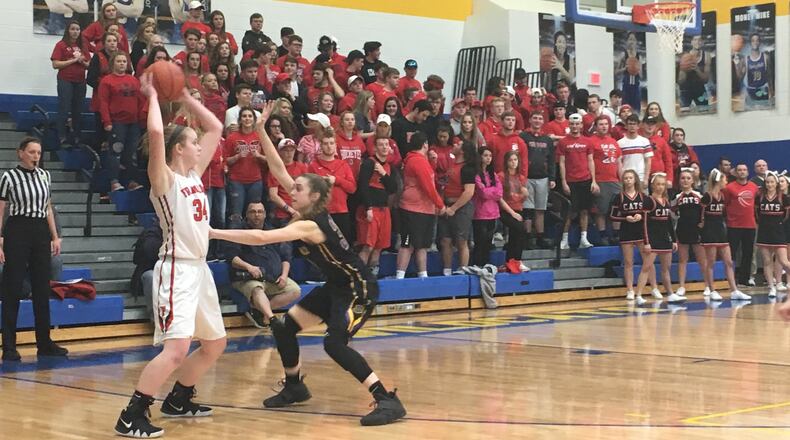 Bellbrook’s Kayla Paul (30) pressures Brooke Stover (34) of Franklin as the FHS student section watches during Tuesday night’s Division II regional semifinal at Springfield. RICK CASSANO/STAFF