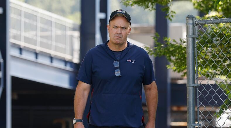 New England Patriots offensive coordinator Bill O'Brien walks onto the field during an NFL football practice, Friday, July 28, 2023, in Foxborough, Mass. (AP Photo/Michael Dwyer)
