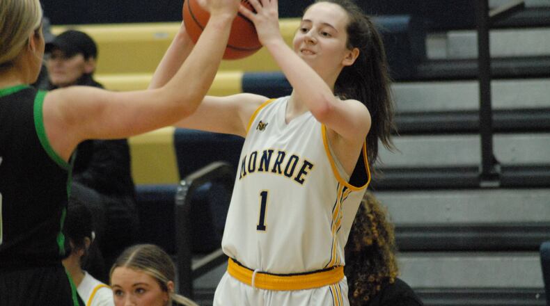 Monroe's Saffron Weidner (1) looks for a passing lane against Harrison on Monday night. Chris Vogt/CONTRIBUTED