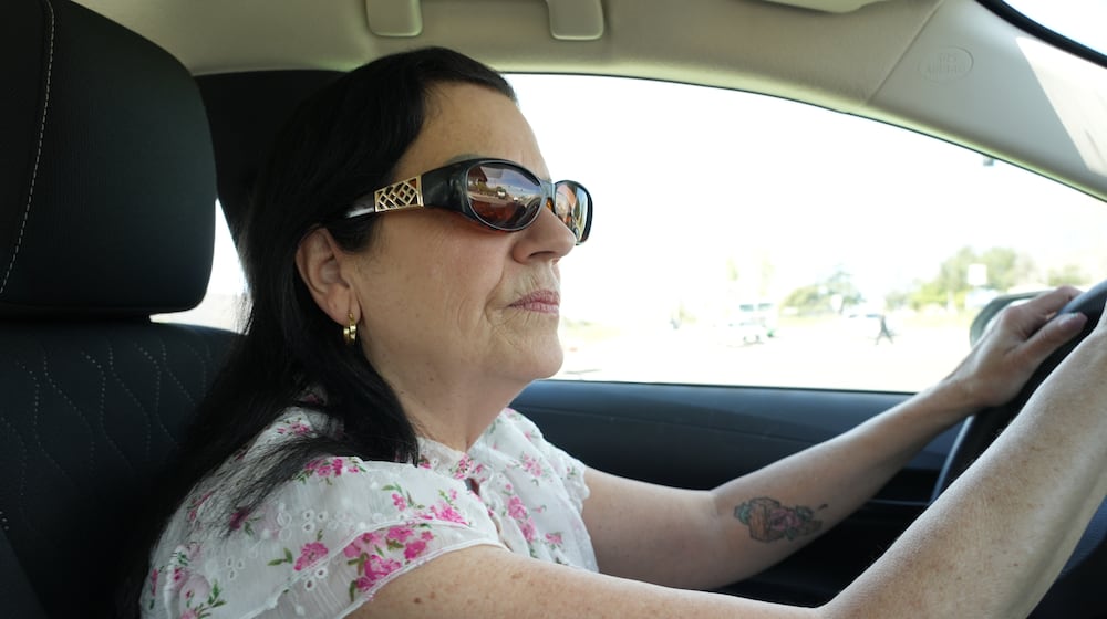 Leslie Sherman-Shafer, an Uber driver, drives her car in Alameda, Calif, March 23, 2026. (AP Photo/Terry Chea)
