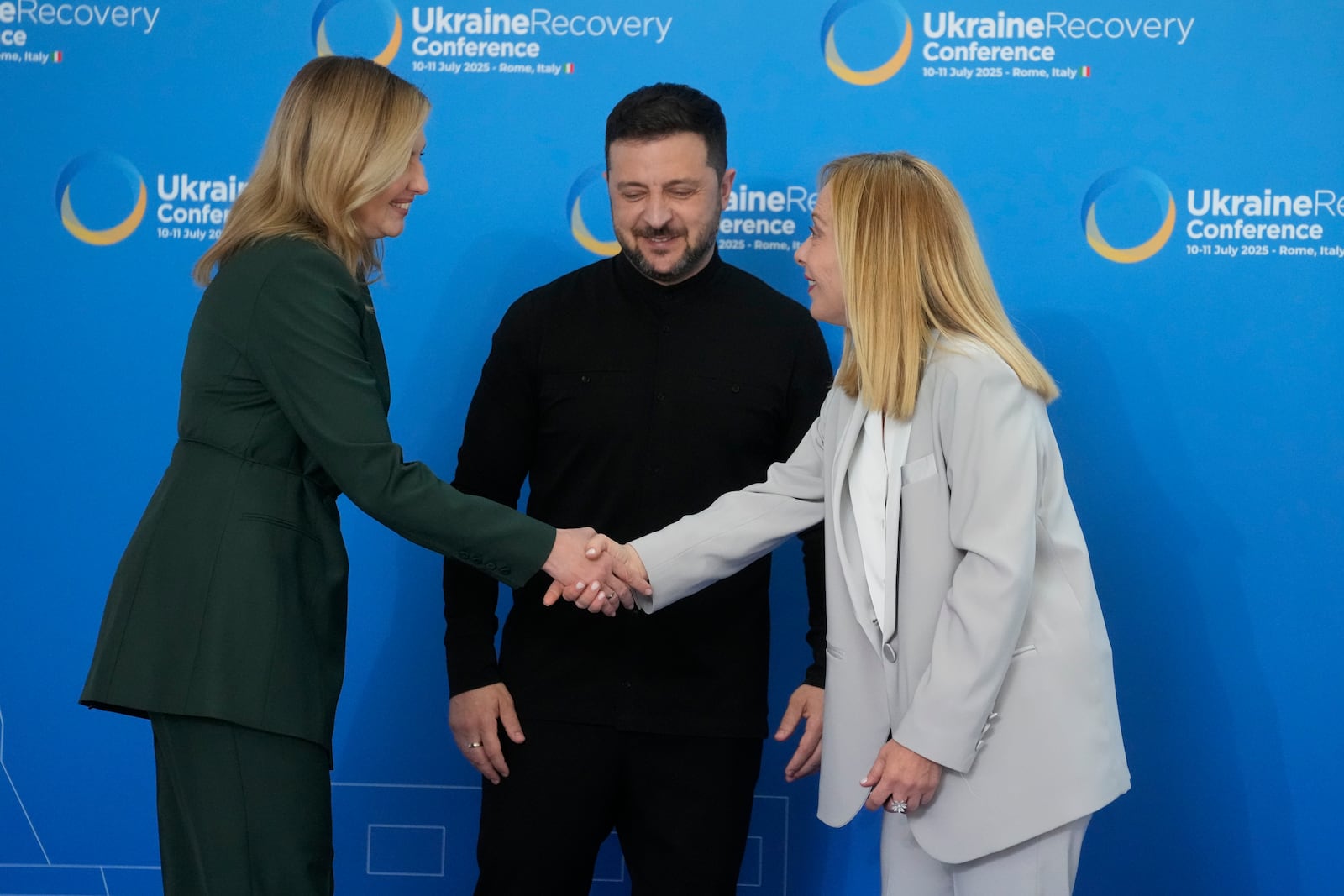 Ukraine's President Volodymyr Zelenskyy, and his wife Olena Zelenska are welcomed by Italian Prime Minister Giorgia Meloni during the Ukraine Recovery Conference at La Nuvola convention center in Rome, Thursday, July 10, 2025. (AP Photo/Gregorio Borgia)