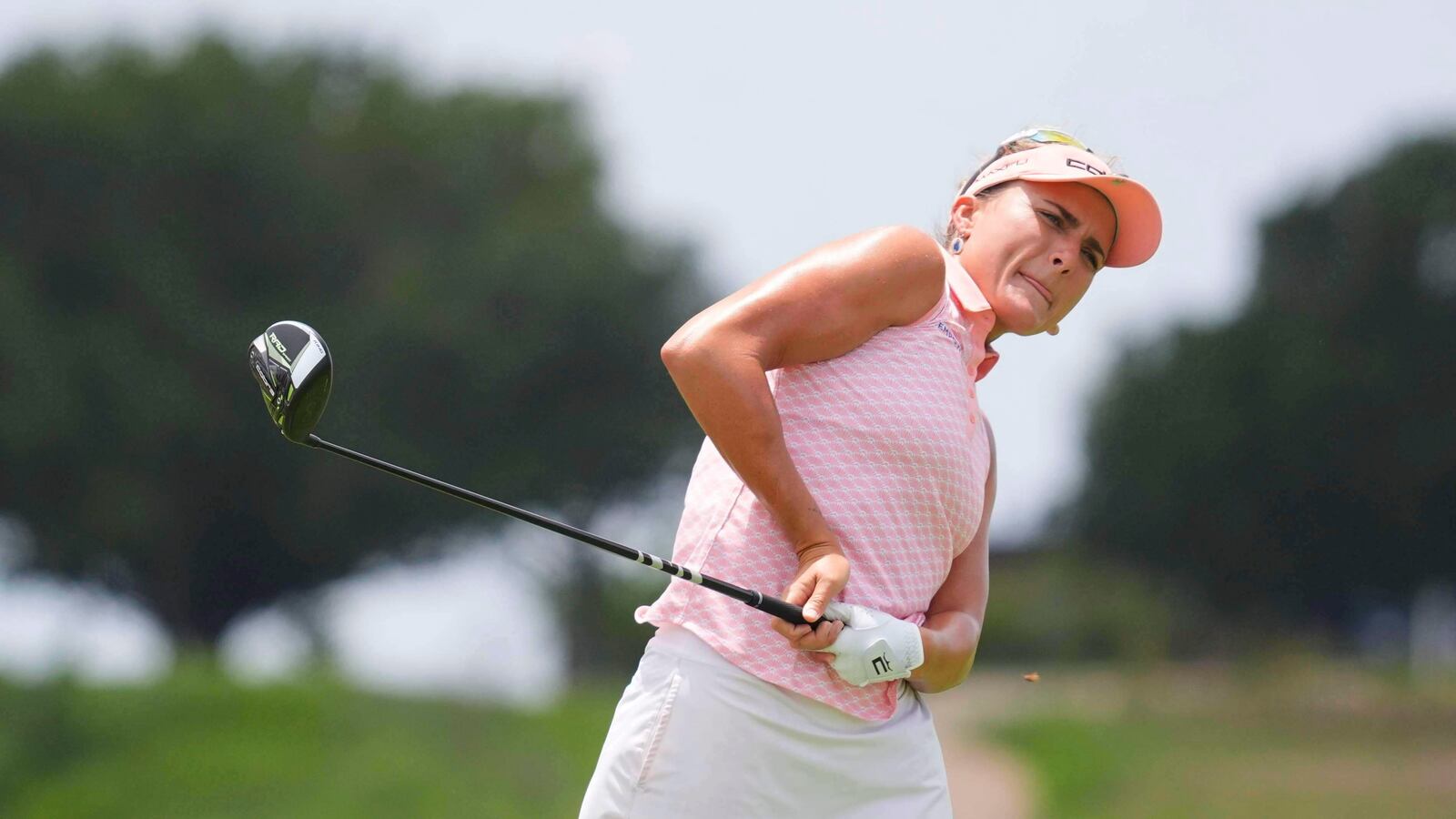 Lexi Thompson watcher her tee shot on the sixth hole during the third round of the Women's PGA Championship golf tournament Saturday, June 21, 2025, in Frisco, Texas. (AP Photo/LM Otero)