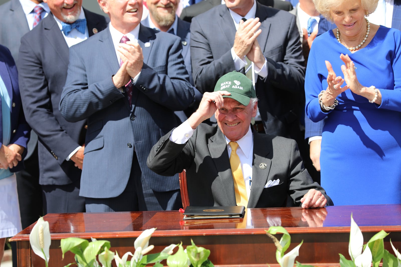 Republican South Carolina Gov. Henry McMaster wears a Santee Cooper hat during a ceremony to celebrate a law changing South Carolina energy policy on Wednesday, June 18, 2025, in Columbia, S.C. (AP Photo/Jeffrey Collins)