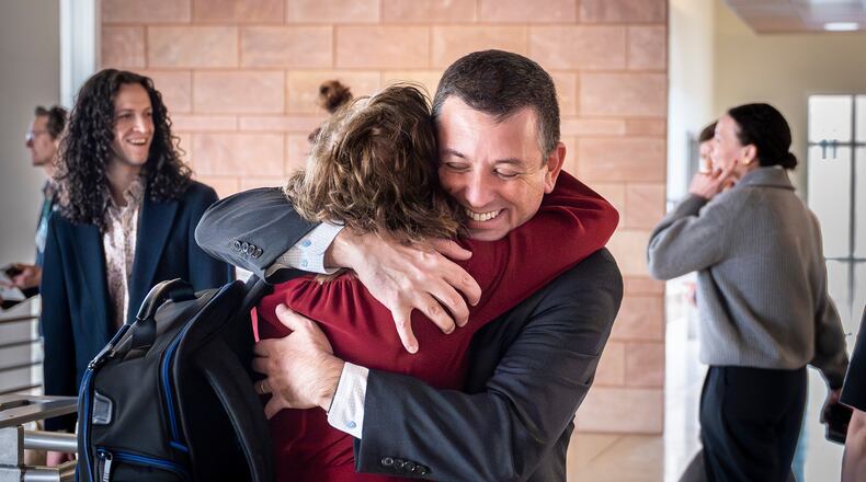Civil litigator David Ackerman embraces New Mexico state attorney Linda Singer following a landmark verdict where the jury found Meta willfully violated New Mexico's consumer protection laws and are ordered to pay the state $375 million in damages, Tuesday, March 24, 2026 , in Santa Fe, N.M. (Nathan Burton/Santa Fe New Mexican via AP, Pool)