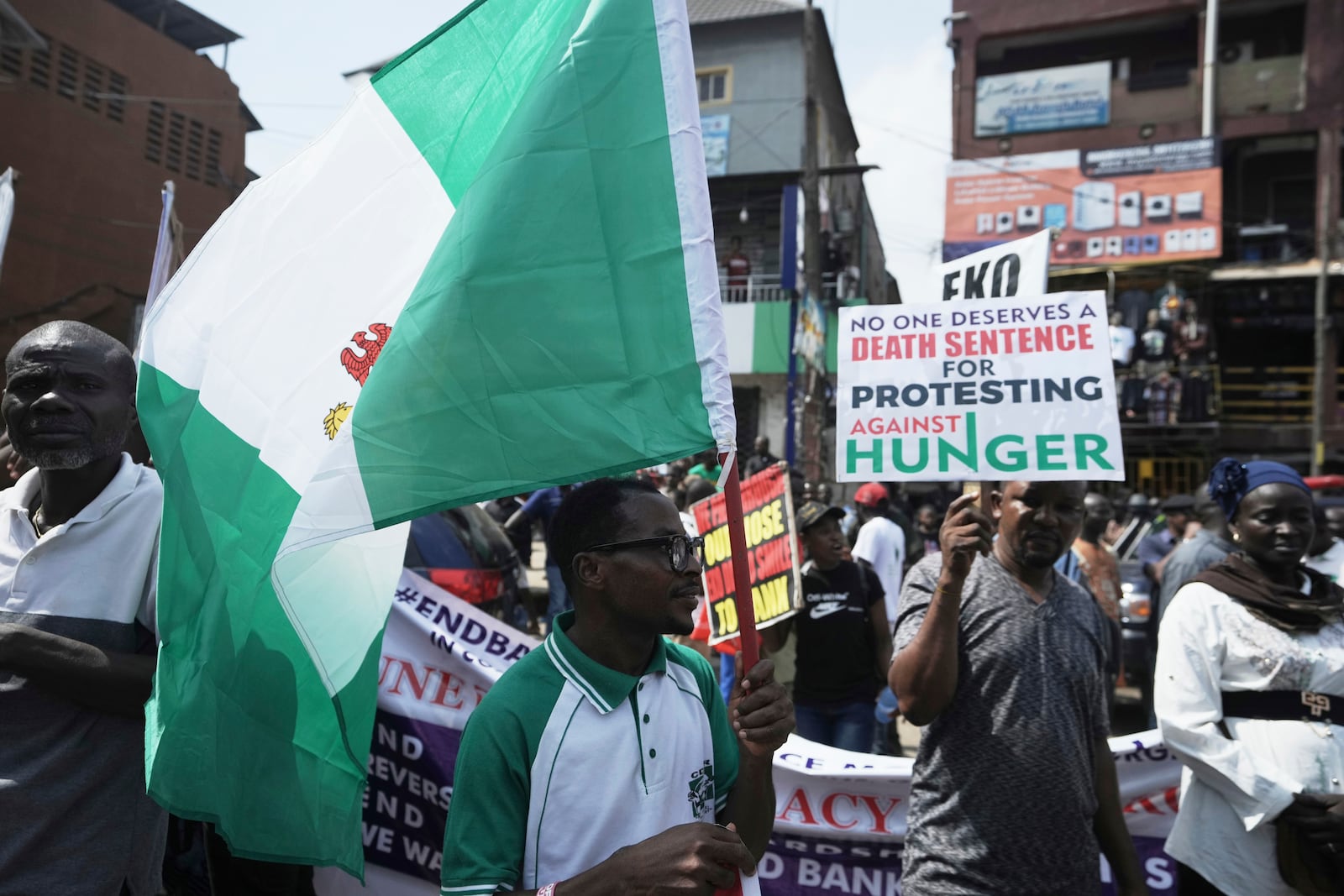 People attend anti-government protests on streets of Lagos, Nigeria, Thursday, June 12, 2025. (AP Photo/Sunday Alamba)
