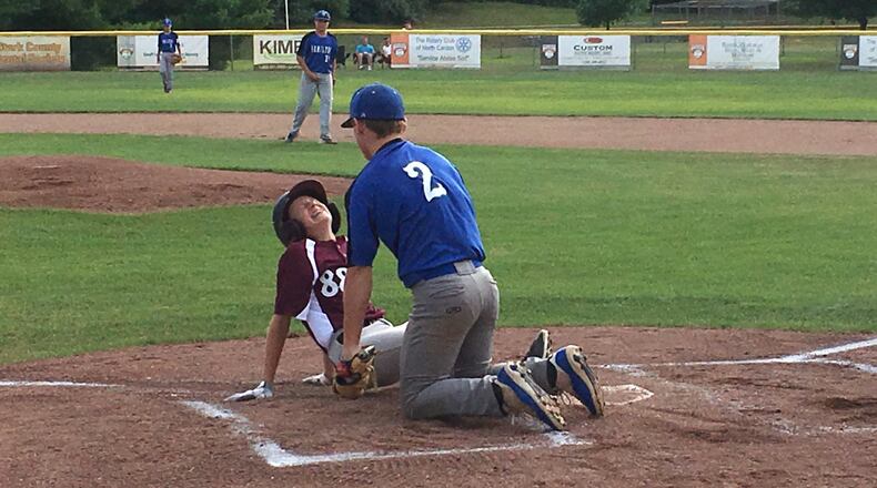 Boardman’s Cal Huston scores a painful run after a wild pitch by Hamilton West Side’s Jonathan Alcorn (2) during Friday’s night’s losers’ bracket final of the Ohio Little League Tournament at the Hoover Community Recreation Complex in North Canton. Boardman advanced with a 5-4 win. RICK CASSANO/STaFF