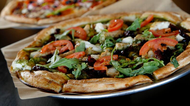 Rapid Fired Pizza is a Kettering-based pizza chain that serves fresh-made pizza in just 180 seconds. Rapid Fired Pizza will be one of the first tenants at a new development being built in Fairfield. STAFF FILE/2015